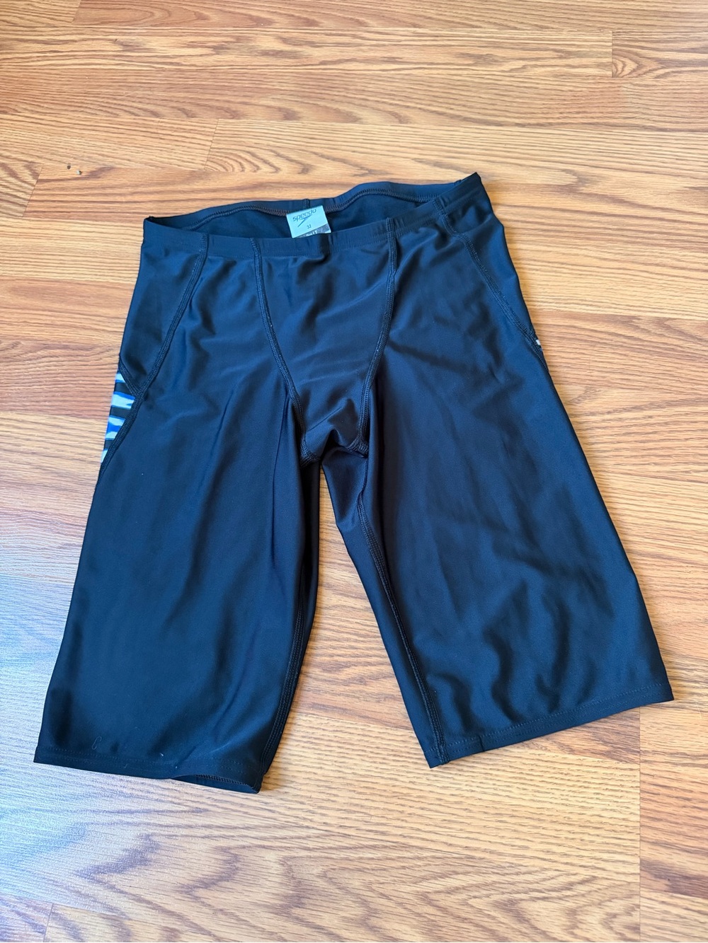 Speedo black swim shorts with blue stripes Size 32